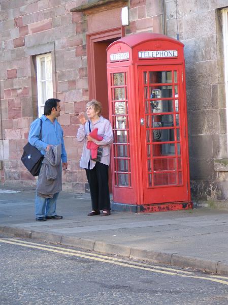 Chatting at the phone box.JPG